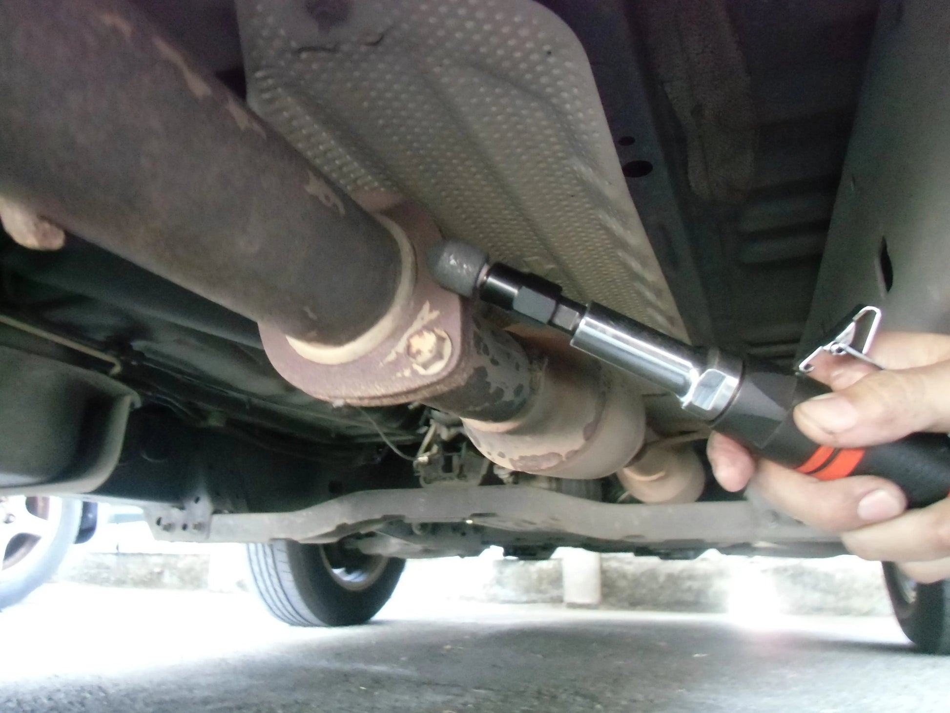 a close up of a person working on a vehicle